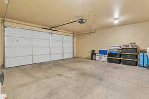 Garage featuring a garage door opener