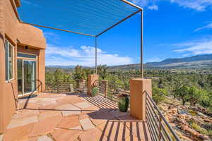 View of patio / terrace with a mountain view and a balcony
