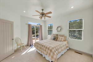 Bedroom with baseboards, recessed lighting, visible vents, access to exterior, and light colored carpet