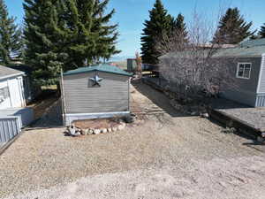 Exterior space featuring an outbuilding and a storage shed