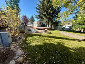 View of yard with a sunroom