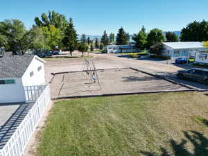 View of yard with fence, a playground, and a residential view