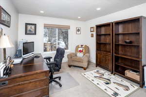 Home office featuring baseboards, carpet floors, and recessed lighting