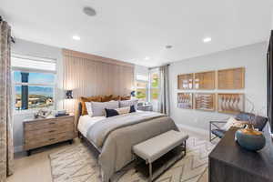 Bedroom featuring light wood finished floors, baseboards, and recessed lighting
