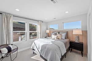 Carpeted bedroom featuring recessed lighting, visible vents, and baseboards
