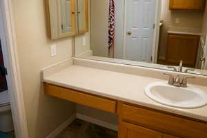 Bathroom with vanity and toilet