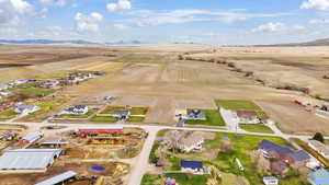 Birds eye view of property featuring a rural view and a mountain view