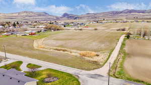 Birds eye view of property with a residential view and a mountain view