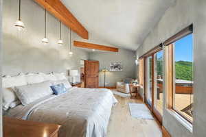 Bedroom featuring light wood finished floors and access to outside