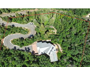 Aerial view of property and surrounding area with property parcel outlined