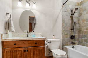 Full bath featuring vanity, and tub / shower combination