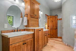 Full bath /primary-ensuite featuring his and her vanities, and a huge walk in closet.
