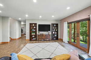 Living room with baseboards and recessed lighting