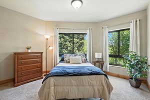 Carpeted bedroom with baseboards