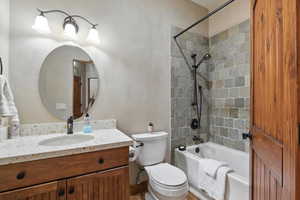 Full bathroom with bathing tub / shower combination and vanity
