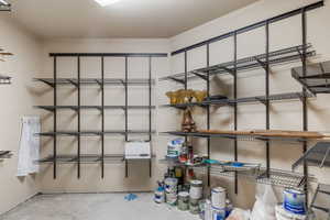 Gear and storage room adjacent to heated 3 car garage with 220 power and spiget.