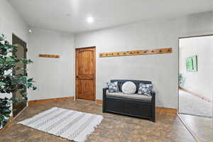 Sitting room featuring baseboards