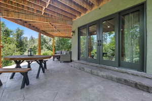 View of patio featuring french doors and an outdoor living space