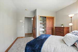 Bedroom with carpet floors and a closet