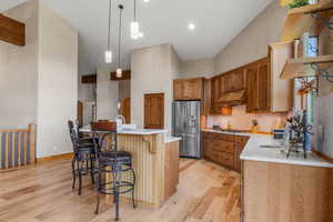 Open Kitchen featuring quartz countertops, and a spacious island