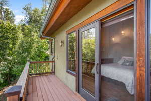 The Deck off the primary suite complete with a hot tub, is ideal for unwinding  after a long day or star gazing.