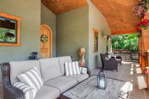 Porch featuring an outdoor gathering area