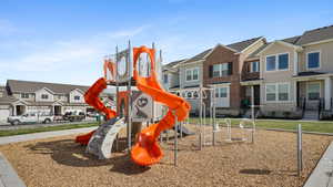 Community playground featuring a residential view