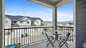 Balcony with a mountain view and a residential view