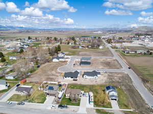 Birds eye view of property with a mountain view and a residential view
