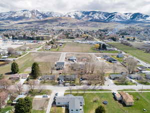 Drone / aerial view featuring a residential view and a mountain view