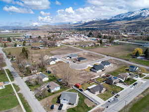 Birds eye view of property with a residential view and a mountain view