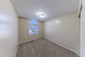 Bedroom 1 featuring carpet and baseboards