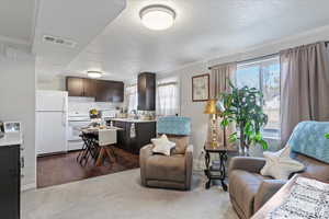 ADU sitting room with kitchen view and bright windows