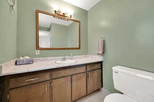 Bathroom featuring toilet and vanity