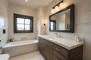 Full bath featuring tile walls, vanity, a bath, and tile patterned floors