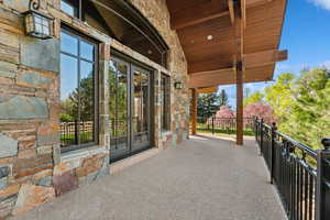 View of patio / terrace with a balcony and french doors