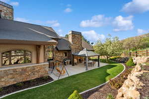 View of yard with a patio and a gazebo