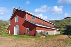 Back of property featuring a garage