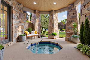 View of pool featuring a hot tub