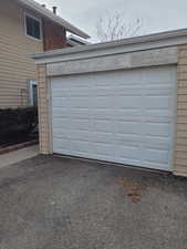 Garage featuring aphalt driveway