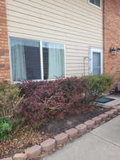 View of side of property with brick siding