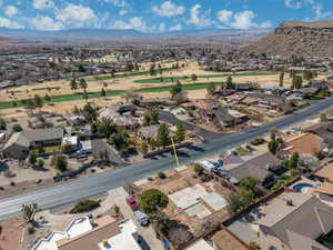 Birds eye view of property featuring a mountain view, view of golf course, and a residential view