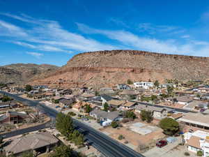 Birds eye view of property featuring a mountain view and a residential view