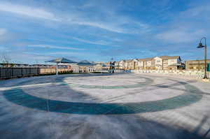 Surrounding community with a gazebo, fence, and a residential view