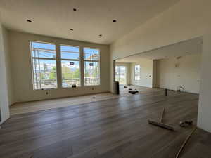 Unfurnished living room with wood finished floors