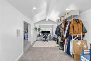Carpeted home office with visible vents, baseboards, recessed lighting, and lofted ceiling with beams