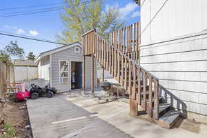 Exterior space with a patio and fence