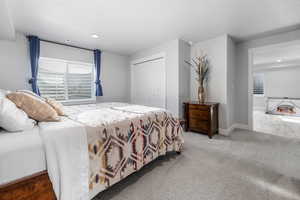 Bedroom featuring recessed lighting, carpet, a closet, and baseboards