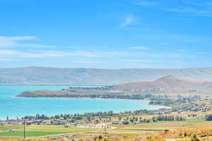 Property view of mountains featuring a water view