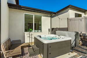 View of patio featuring a hot tub